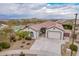 Single-story home with pool and desert landscaping; two-car garage, spacious backyard at 24147 N 165Th Ln, Surprise, AZ 85387