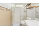 Clean bathroom with shower, toilet and wood shelving at 24147 N 165Th Ln, Surprise, AZ 85387