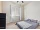 Spacious bedroom with carpeted floor and large window at 24147 N 165Th Ln, Surprise, AZ 85387