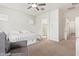 Bright bedroom with ensuite bathroom access and ceiling fan at 24147 N 165Th Ln, Surprise, AZ 85387
