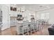 Spacious kitchen featuring white cabinets, a large island, and stainless steel appliances at 24147 N 165Th Ln, Surprise, AZ 85387