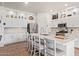 Modern kitchen with white cabinets, large island, and stainless steel appliances at 24147 N 165Th Ln, Surprise, AZ 85387