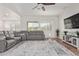 Relaxing living room featuring a large sectional sofa and flat-screen TV at 24147 N 165Th Ln, Surprise, AZ 85387