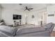 Open living room showcasing a comfortable sectional sofa and a flat-screen TV at 24147 N 165Th Ln, Surprise, AZ 85387