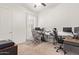 Home office with two desks, multiple monitors, and ample space at 24147 N 165Th Ln, Surprise, AZ 85387