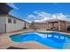 Relaxing pool area with a pergola and plenty of space for lounging at 24147 N 165Th Ln, Surprise, AZ 85387