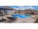 Stunning pool area with lounge chairs and a modern pergola at 24147 N 165Th Ln, Surprise, AZ 85387