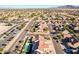 Aerial view showcasing a house with a pool and surrounding neighborhood at 2442 E Winged Foot Dr, Chandler, AZ 85249