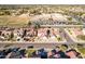 Aerial view of a residential neighborhood with a school and houses at 2442 E Winged Foot Dr, Chandler, AZ 85249