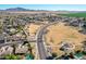 Aerial view of community with park, playground, and homes; mountains in background at 2442 E Winged Foot Dr, Chandler, AZ 85249