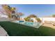 Landscaped backyard with pool and artificial turf at 2442 E Winged Foot Dr, Chandler, AZ 85249