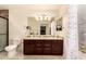 Double vanity bathroom with granite countertops at 2442 E Winged Foot Dr, Chandler, AZ 85249