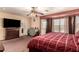 Bright Primary bedroom with a king-size bed and large windows at 2442 E Winged Foot Dr, Chandler, AZ 85249