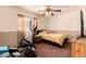Bright bedroom with elliptical and double bed at 2442 E Winged Foot Dr, Chandler, AZ 85249