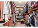Large walk-in closet with ample shelving and hanging space at 2442 E Winged Foot Dr, Chandler, AZ 85249