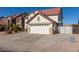 Two-story house with a large garage and gated driveway at 2442 E Winged Foot Dr, Chandler, AZ 85249
