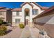 Two-story house with a large garage and walkway at 2442 E Winged Foot Dr, Chandler, AZ 85249