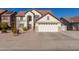 Two-story house with a large garage and landscaped yard at 2442 E Winged Foot Dr, Chandler, AZ 85249