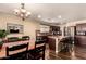 Kitchen with island, stainless steel appliances, and dark wood cabinets at 2442 E Winged Foot Dr, Chandler, AZ 85249