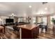 Open concept kitchen with island and stainless steel appliances at 2442 E Winged Foot Dr, Chandler, AZ 85249