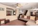 Spacious living room with sectional sofa and built-in shelving at 2442 E Winged Foot Dr, Chandler, AZ 85249