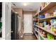 Walk-in pantry with ample shelving for storage at 2442 E Winged Foot Dr, Chandler, AZ 85249