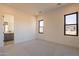 Bedroom with access to the bathroom and great natural light at 25572 N 119Th St, Scottsdale, AZ 85255