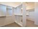 Spacious walk-in closet with custom built-ins at 25572 N 119Th St, Scottsdale, AZ 85255