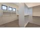 Large walk-in closet with ample shelving and hanging space at 25572 N 119Th St, Scottsdale, AZ 85255