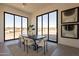 Bright dining area with sliding glass doors and modern dining set at 25572 N 119Th St, Scottsdale, AZ 85255