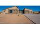 Modern home with a three-car garage and desert landscaping at 25572 N 119Th St, Scottsdale, AZ 85255