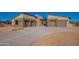 Contemporary home with a three-car garage and desert landscaping at 25572 N 119Th St, Scottsdale, AZ 85255
