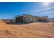 Contemporary home's exterior showcases clean lines and expansive windows at 25572 N 119Th St, Scottsdale, AZ 85255