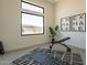 Small home gym with equipment and large window at 25572 N 119Th St, Scottsdale, AZ 85255