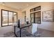 Bright home office with large windows, desk, and two chairs at 25572 N 119Th St, Scottsdale, AZ 85255