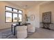 Bright home office with large windows, desk, and two chairs at 25572 N 119Th St, Scottsdale, AZ 85255