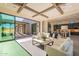 Open living room with kitchen views, high ceilings, and large sliding glass doors at 25572 N 119Th St, Scottsdale, AZ 85255