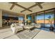 Open living room with kitchen views, high ceilings, and large sliding glass doors at 25572 N 119Th St, Scottsdale, AZ 85255