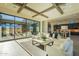 Open living room with kitchen views, high ceilings, and large sliding glass doors at 25572 N 119Th St, Scottsdale, AZ 85255