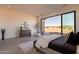 Main bedroom with large windows and a sitting area at 25572 N 119Th St, Scottsdale, AZ 85255