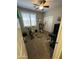 Carpeted bedroom featuring exercise equipment and a large window with shutters at 2573 W Lewis And Clark Trl, Anthem, AZ 85086