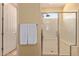 Clean bathroom with a large shower and built-in bench at 28175 N 123Rd Ln, Peoria, AZ 85383