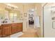 Elegant bathroom with double sinks and walk-in closet at 28175 N 123Rd Ln, Peoria, AZ 85383