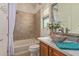 Guest bathroom with a vessel sink and bathtub at 28175 N 123Rd Ln, Peoria, AZ 85383