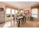 Bright dining area with a table for four and large windows at 28175 N 123Rd Ln, Peoria, AZ 85383