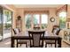 Bright dining room with table and chairs, and access to the backyard at 28175 N 123Rd Ln, Peoria, AZ 85383