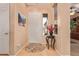Bright and spacious entryway with tile flooring and a coat rack at 28175 N 123Rd Ln, Peoria, AZ 85383