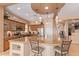 Large kitchen island with granite countertops and pendant lighting at 28175 N 123Rd Ln, Peoria, AZ 85383