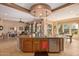Large kitchen island with seating and granite countertops at 28175 N 123Rd Ln, Peoria, AZ 85383