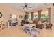 Spacious living room featuring a comfortable couch and large windows at 28175 N 123Rd Ln, Peoria, AZ 85383